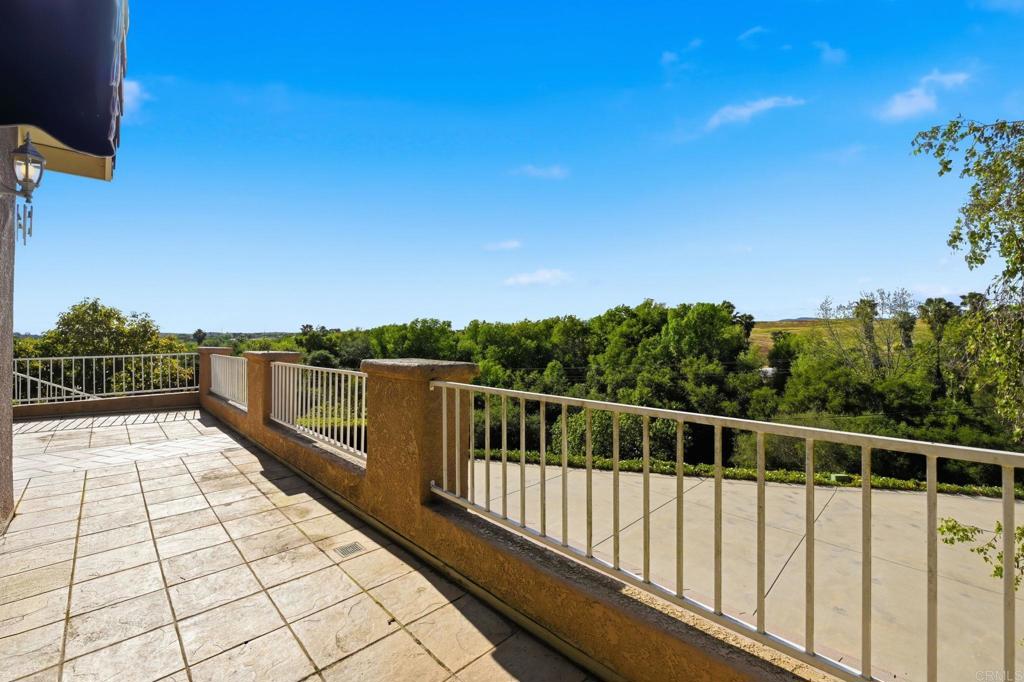 2596 Green Canyon Road Fallbrook, CA 92028 - Photo 32 of 74 a view of balcony with wooden floor and fence