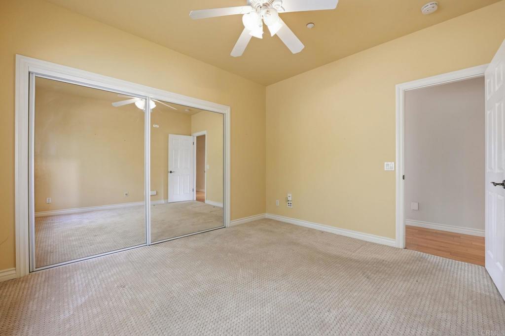 2596 Green Canyon Road Fallbrook, CA 92028 - Photo 39 of 74 a view of an empty room with a chandelier fan