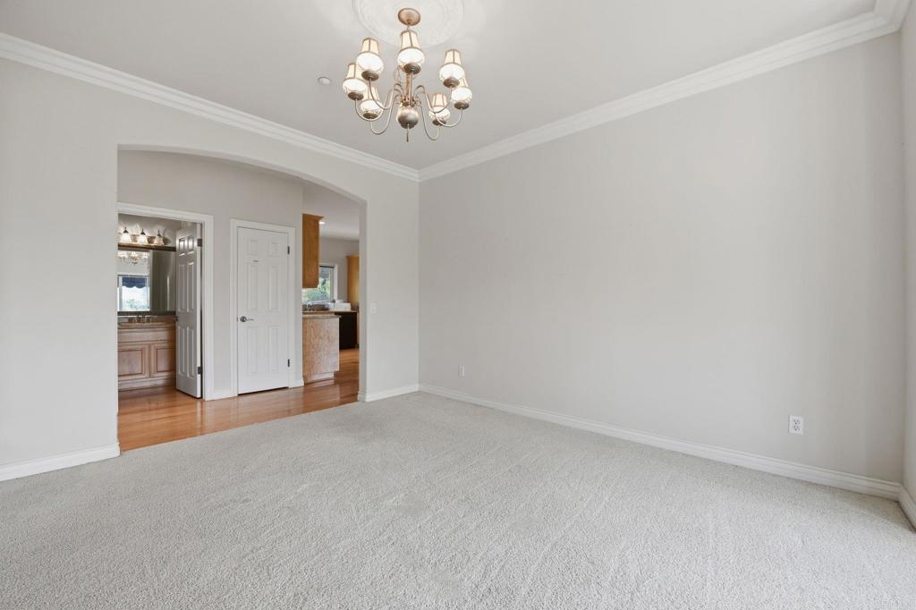 2596 Green Canyon Road Fallbrook, CA 92028 - Photo 9 of 74 a view of an empty room with a chandelier