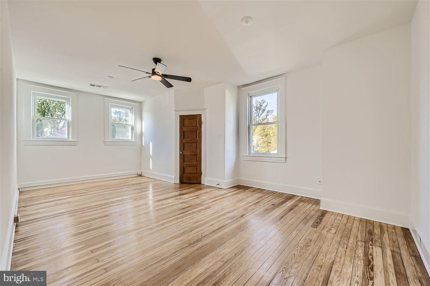 611 Coleraine Road Baltimore, MD 21229 - Photo 25 of 33 wooden floor in an empty room with a window