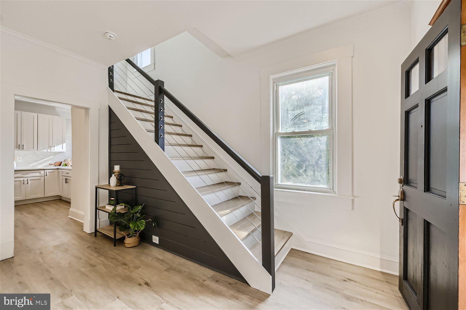 611 Coleraine Road Baltimore, MD 21229 - Photo 4 of 33 a view of entryway and hall with wooden floor