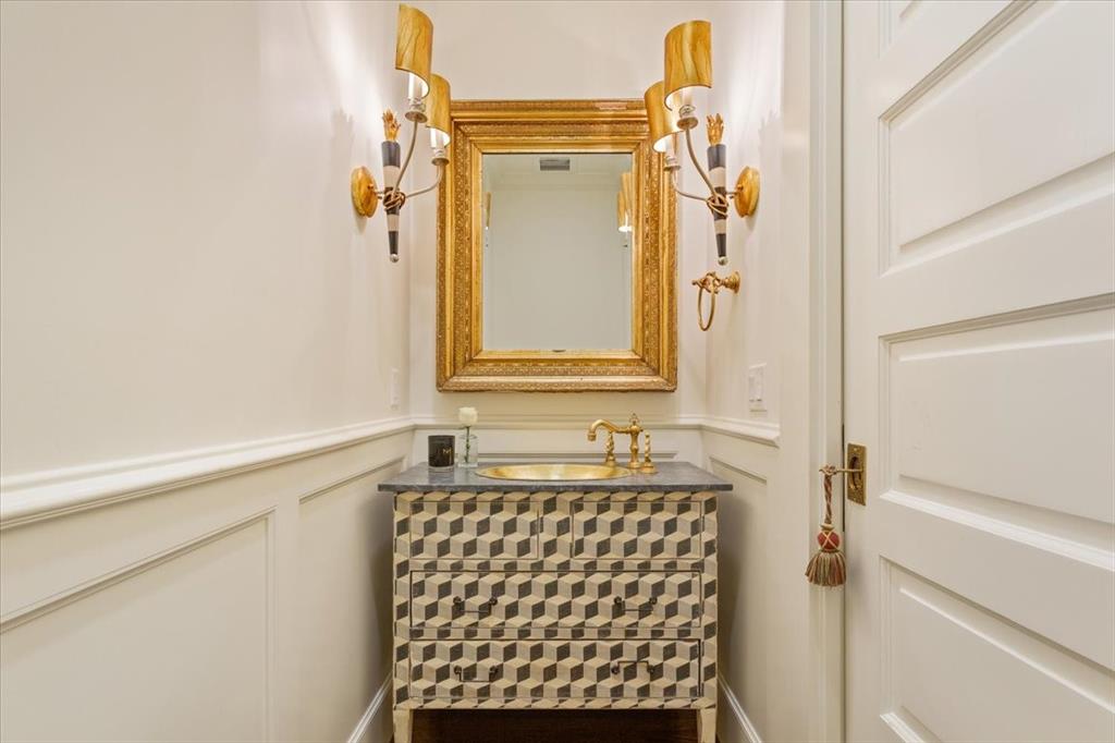 410 Rice Avenue Waco, TX 76708 - Photo 32 of 40 a bathroom with a sink and a mirror