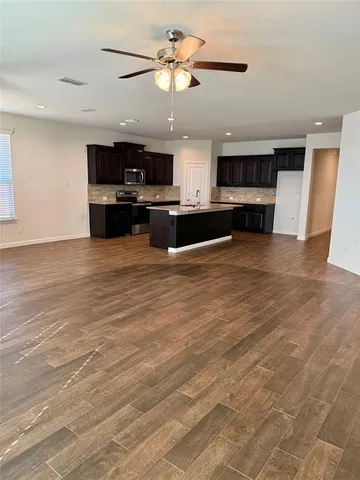 a view of kitchen with sink and cabinets
