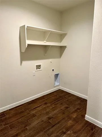 an empty room with wooden floor