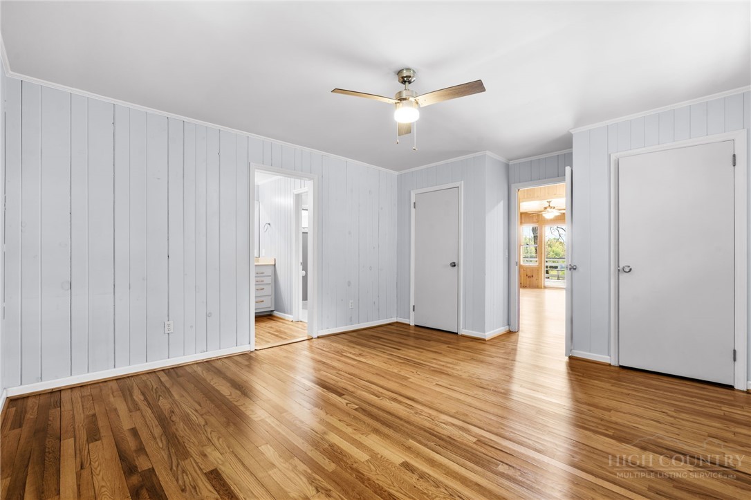 656 Goforth Road Blowing Rock, NC 28605 - Photo 13 of 36 a view of an empty room with wooden floor