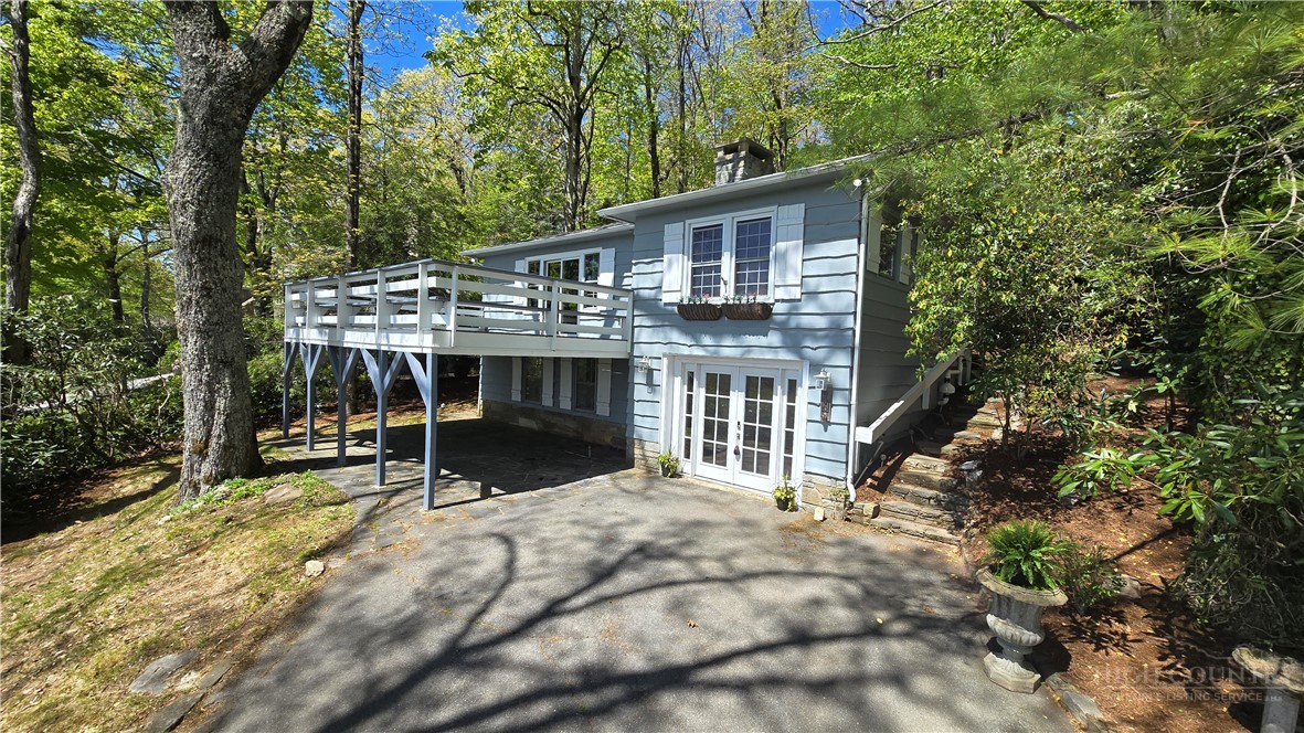 656 Goforth Road Blowing Rock, NC 28605 - Photo 2 of 36 a house with trees in the background