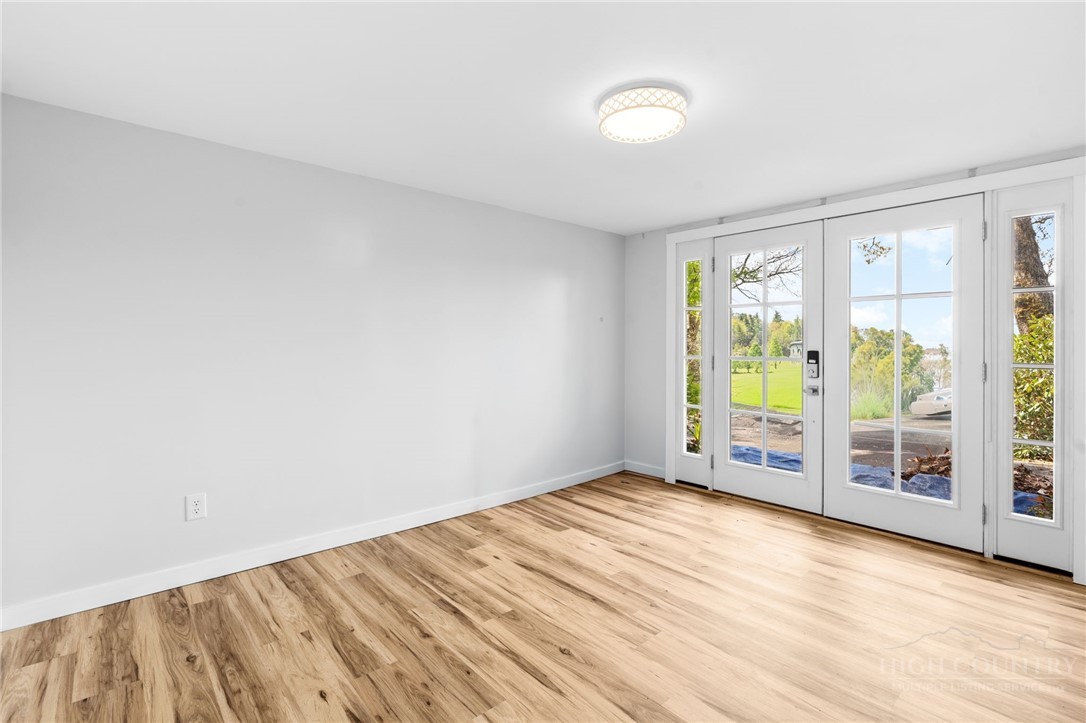 656 Goforth Road Blowing Rock, NC 28605 - Photo 24 of 36 wooden floor in an empty room with a window