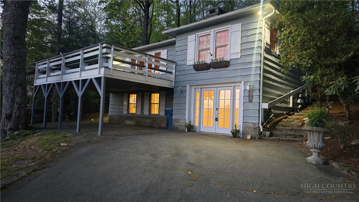 656 Goforth Road Blowing Rock, NC 28605 - Photo 34 of 36 a view of a house with a porch and furniture