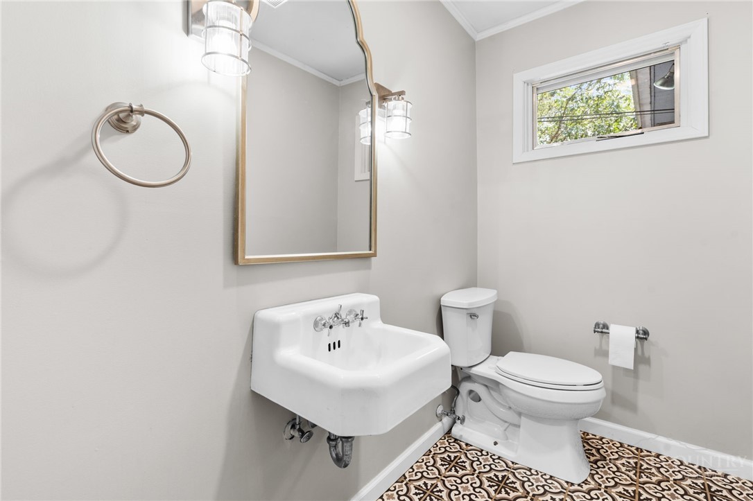 656 Goforth Road Blowing Rock, NC 28605 - Photo 10 of 36 a bathroom with a toilet sink and mirror