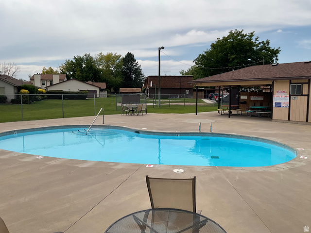 621 Coachman Way Riverdale, UT 84405 - Photo 29 of 38 Community pool featuring a patio and outdoor dining space