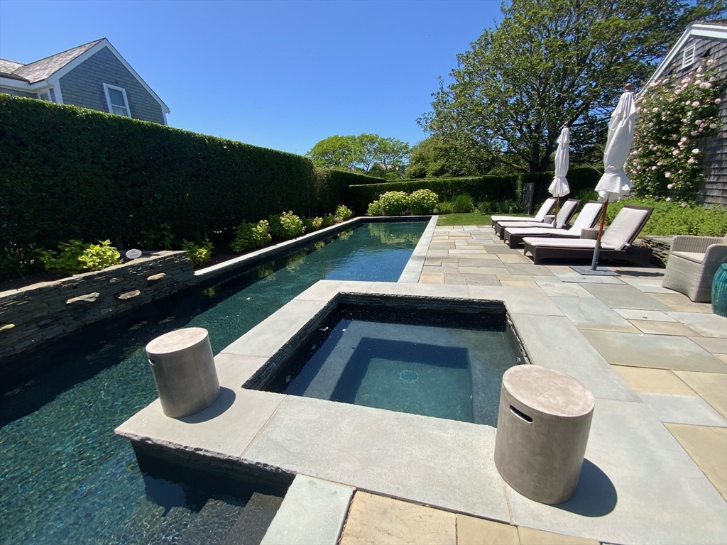 17 Burnell Street Nantucket, MA 02554 - Photo 7 of 24 a view of a patio with chairs and plants