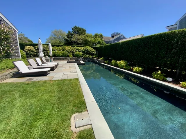 a view of a garden with houses