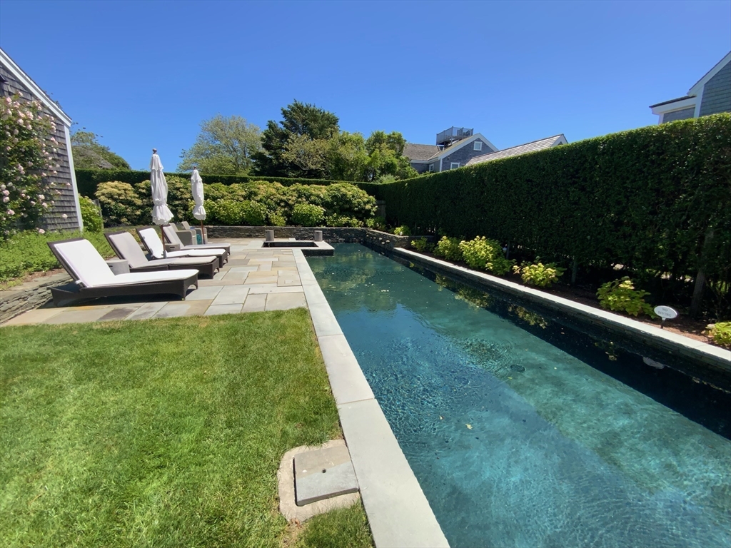17 Burnell Street Nantucket, MA 02554 - Photo 8 of 24 a view of a garden with houses
