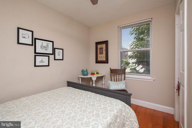 a bedroom with bed and a window