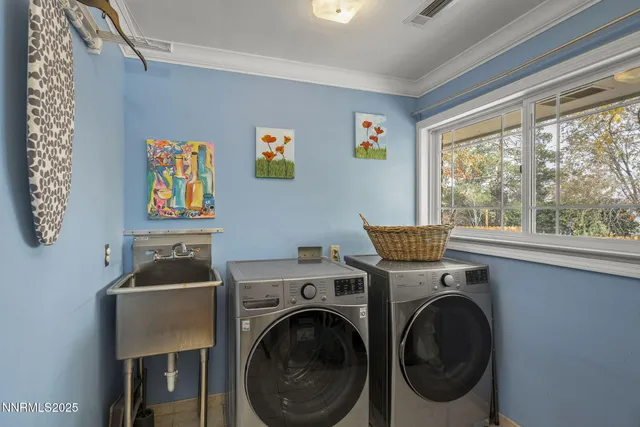 a room with a window and a washer dryer