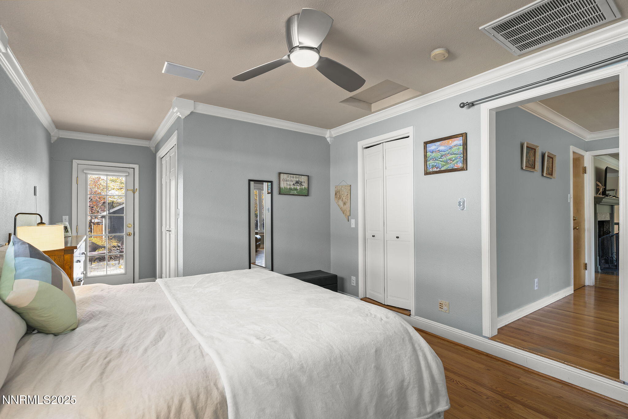 2260 Sunrise Drive Reno, NV 89509 - Photo 18 of 44 a bedroom with a large bed and a chandelier