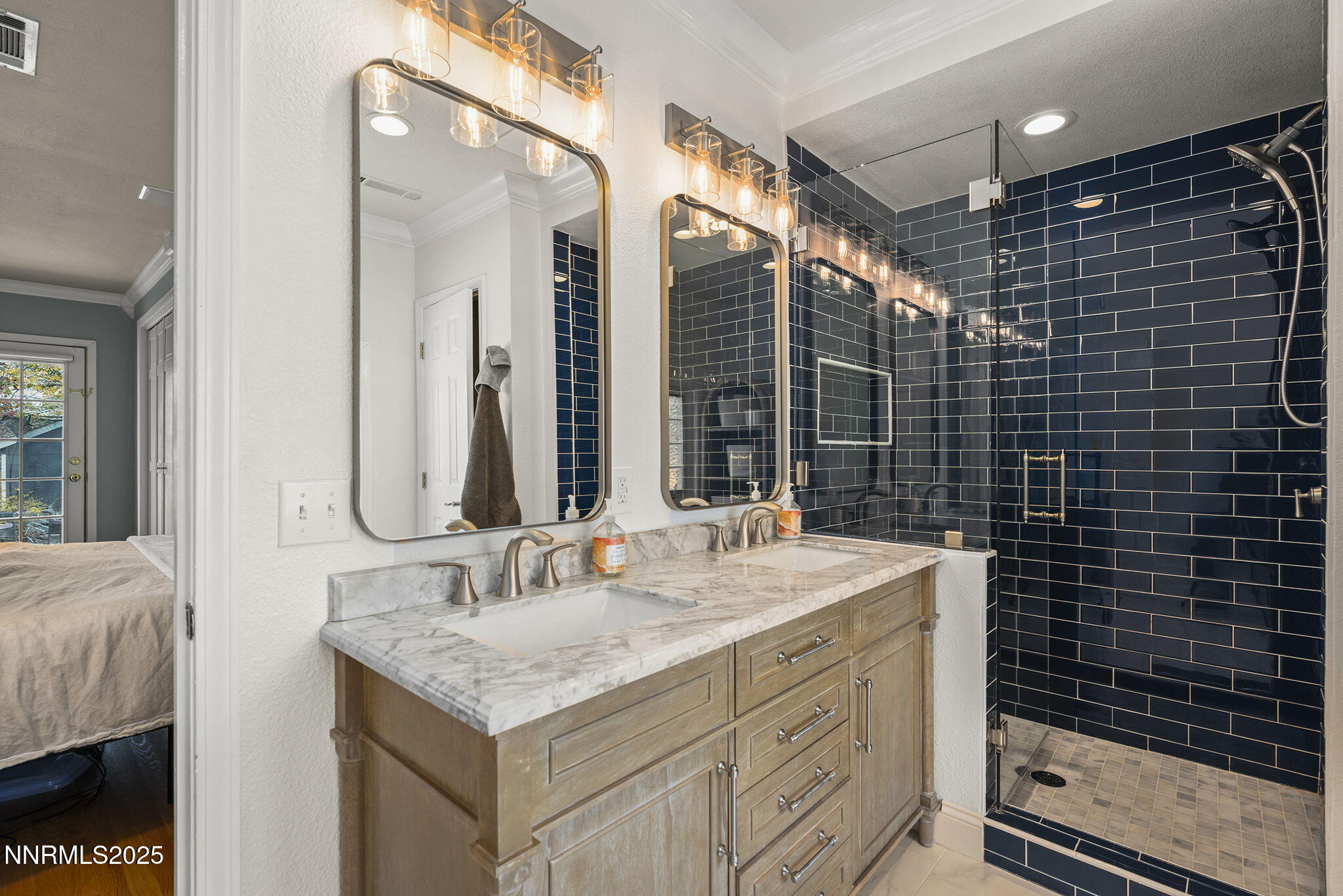 2260 Sunrise Drive Reno, NV 89509 - Photo 21 of 44 a bathroom with a granite countertop sink a mirror and a shower