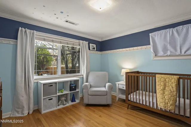 a bedroom with furniture and a window