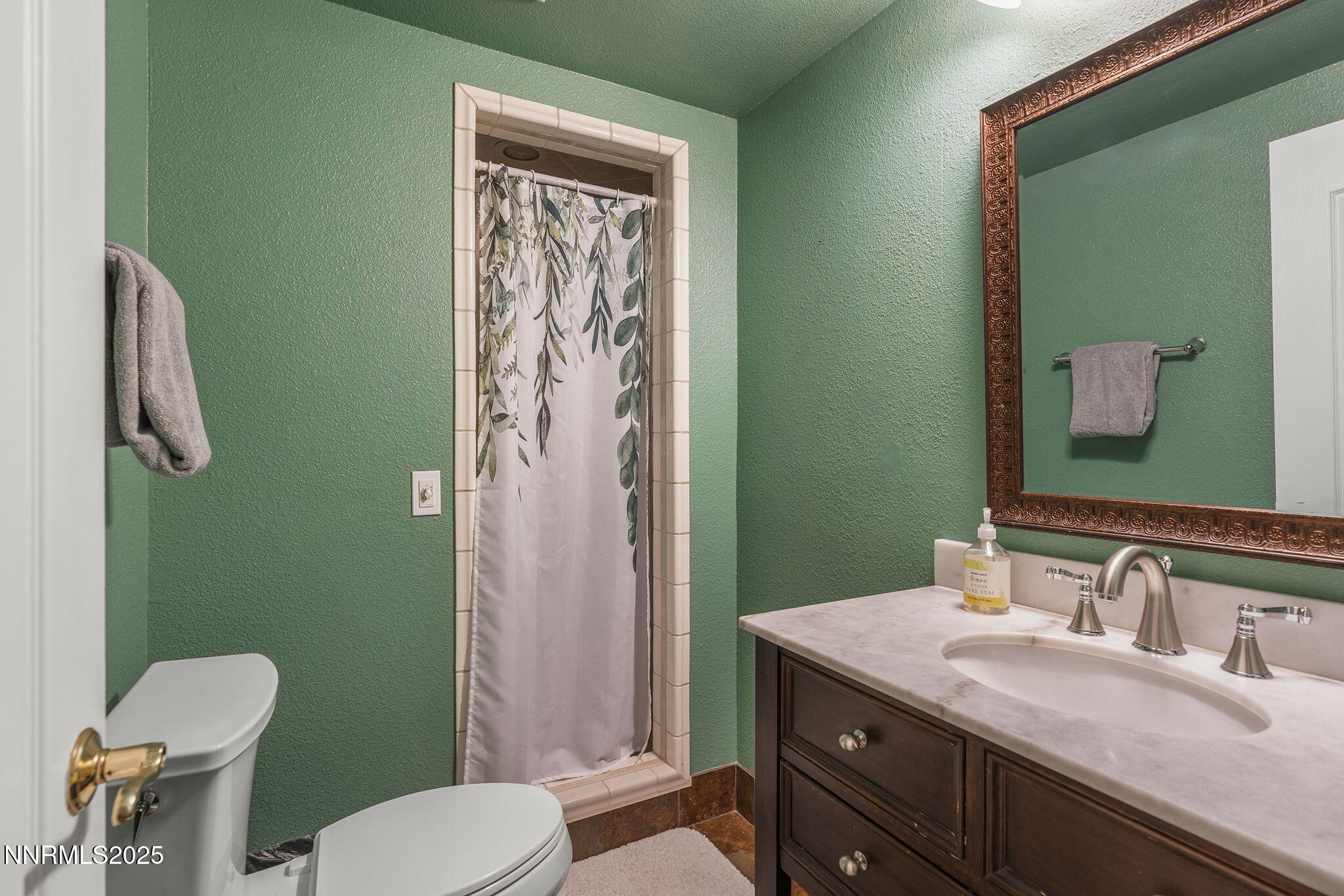 2260 Sunrise Drive Reno, NV 89509 - Photo 30 of 44 a bathroom with a granite countertop toilet sink and mirror