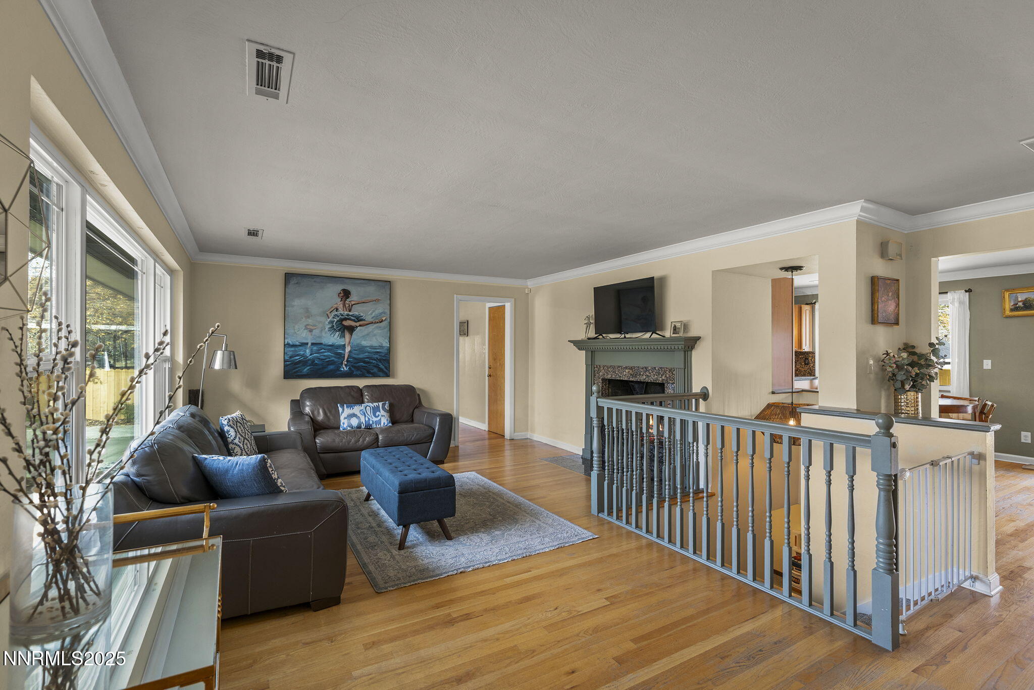 2260 Sunrise Drive Reno, NV 89509 - Photo 4 of 44 a living room with furniture a flat screen tv and a wooden floor