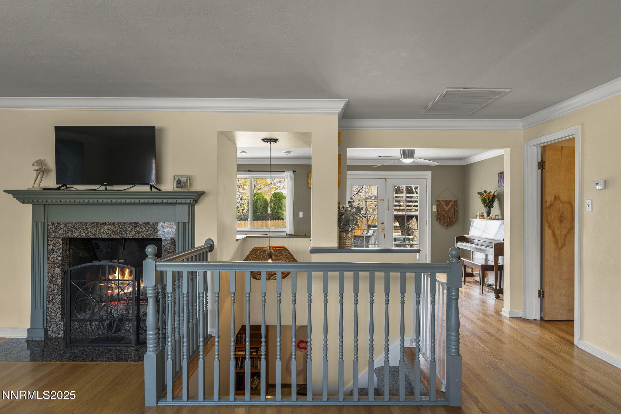2260 Sunrise Drive Reno, NV 89509 - Photo 7 of 44 a living room with wooden floor and a fireplace
