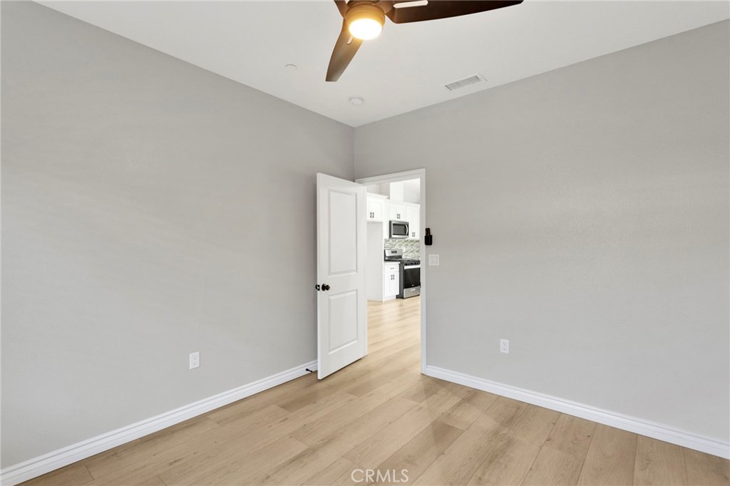 16150 Smoke Tree Street Hesperia, CA 92345 - Photo 17 of 32 a view of a kitchen with a sink