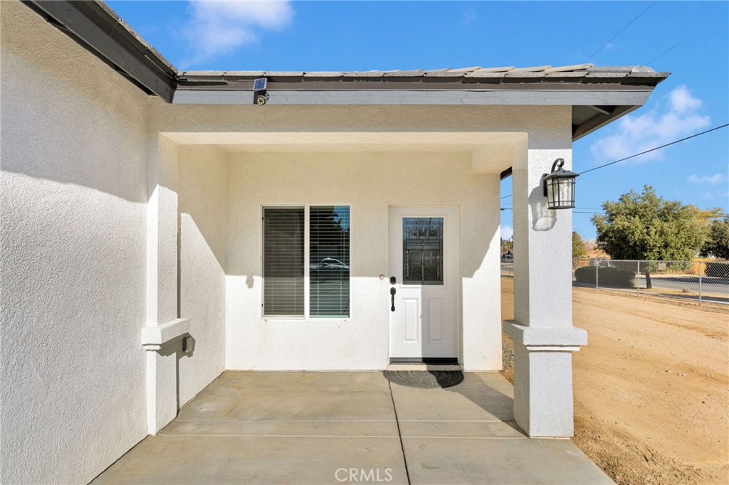 16150 Smoke Tree Street Hesperia, CA 92345 - Photo 4 of 32 a view of a entryway door of the house