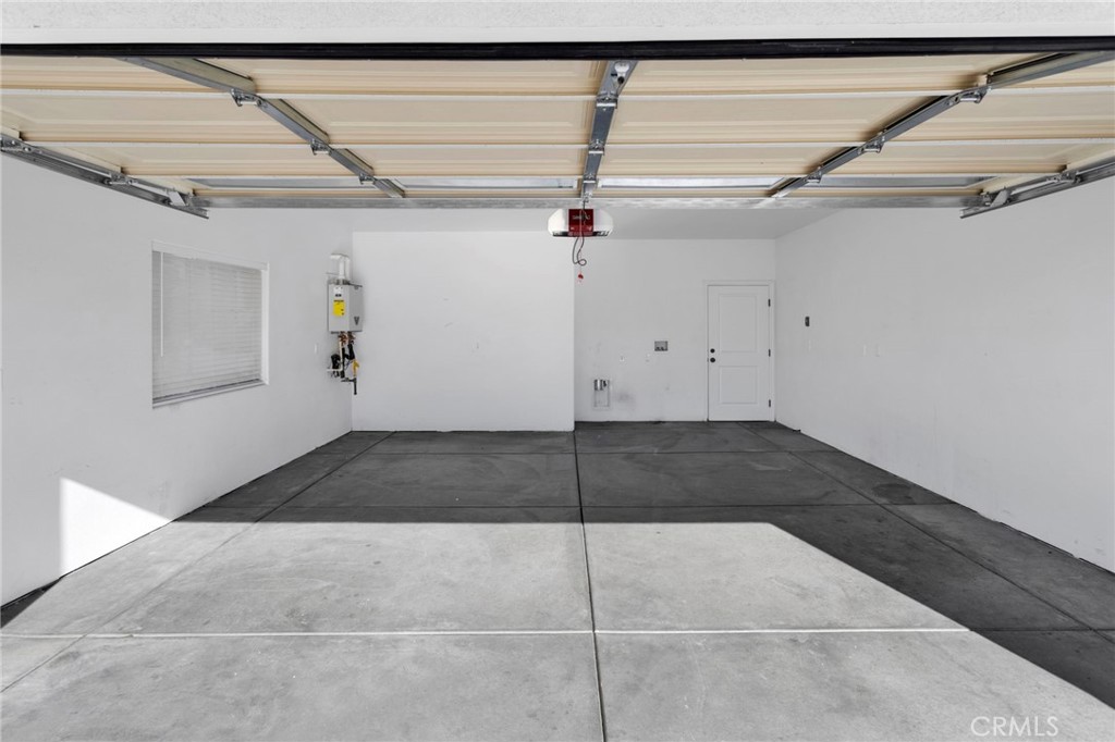 16150 Smoke Tree Street Hesperia, CA 92345 - Photo 7 of 32 a view of a garage