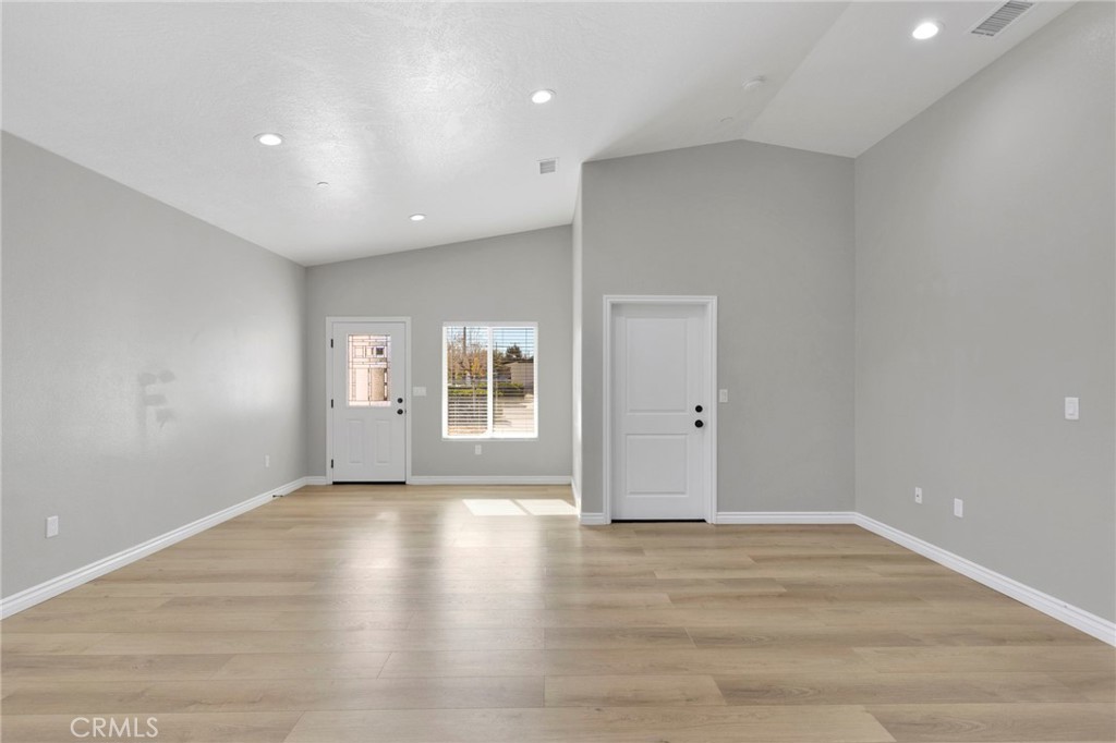 16150 Smoke Tree Street Hesperia, CA 92345 - Photo 8 of 32 wooden floor in an empty room with a window