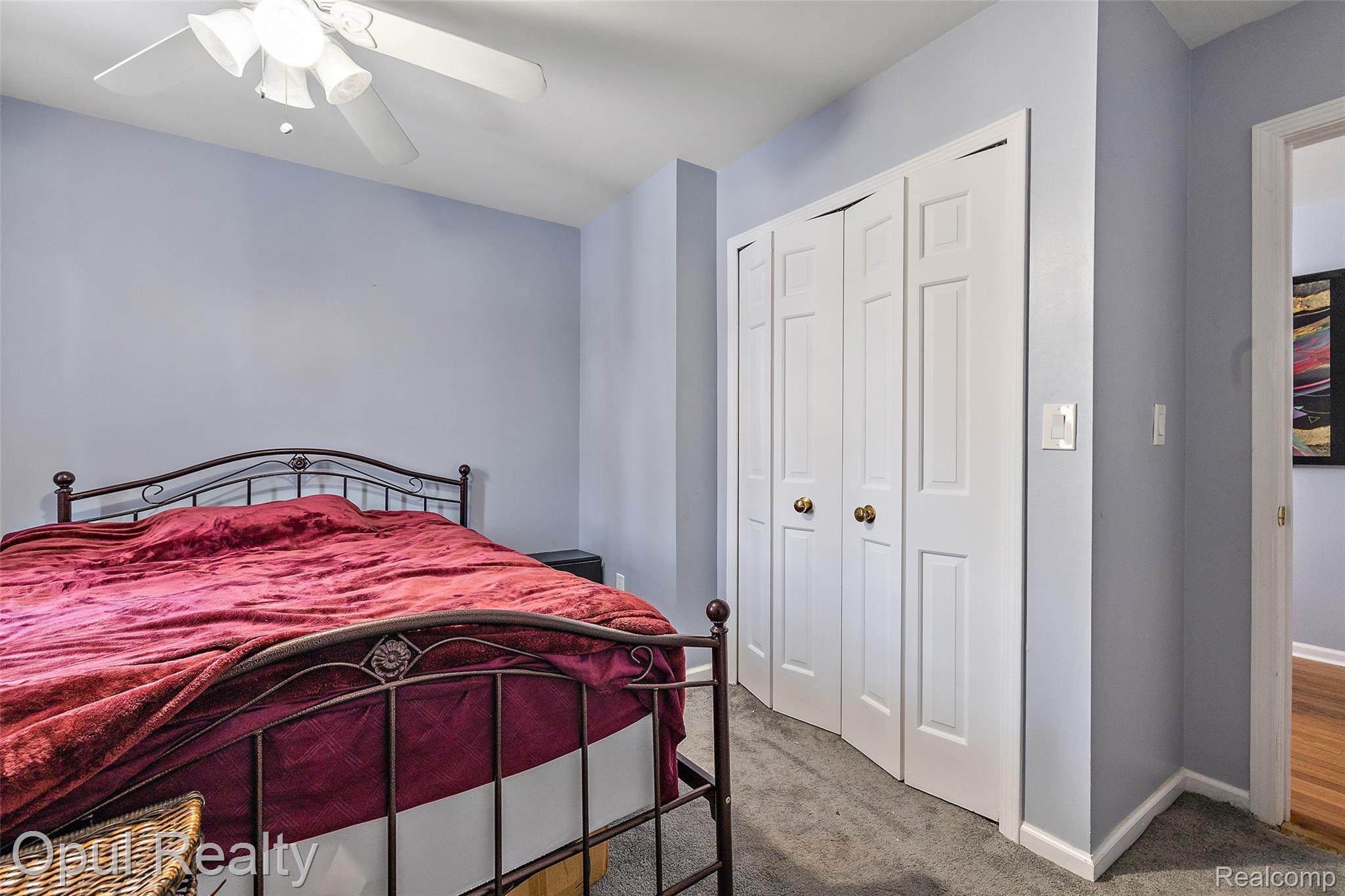 8855 Gross Road Dexter, MI 48130 - Photo 40 of 45 Recessed lighting, ceiling fan, bi-fold closet doors, and light gray wall paint
