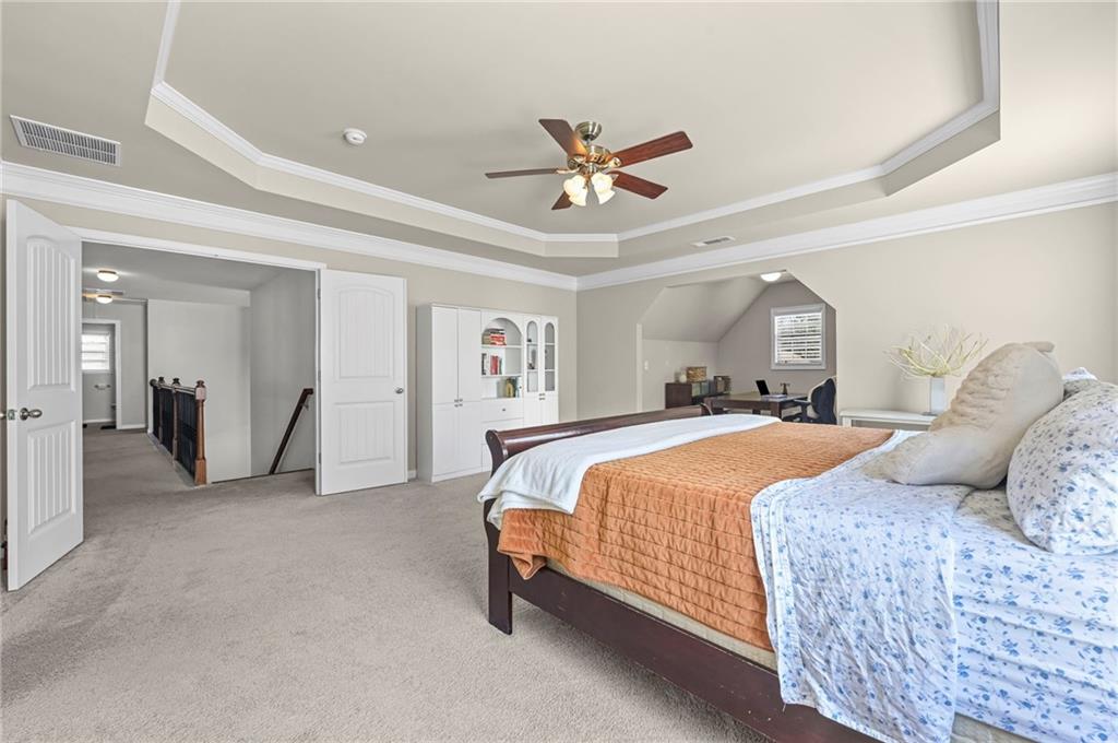 780 Springs Crest Drive Dallas, GA 30157 - Photo 20 of 47 a bedroom with a bed and ceiling fan