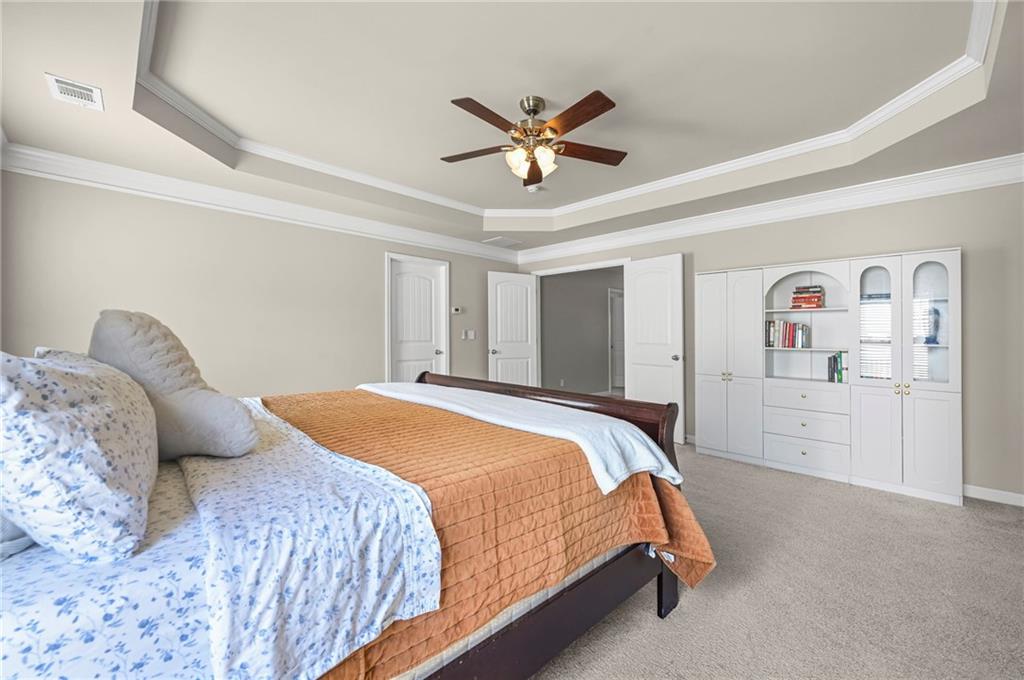 780 Springs Crest Drive Dallas, GA 30157 - Photo 21 of 47 a bedroom with a bed and ceiling fan