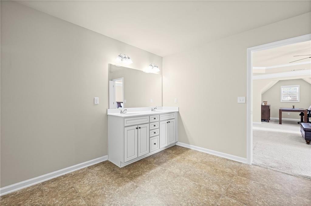 780 Springs Crest Drive Dallas, GA 30157 - Photo 22 of 47 a bathroom with a sink and a mirror