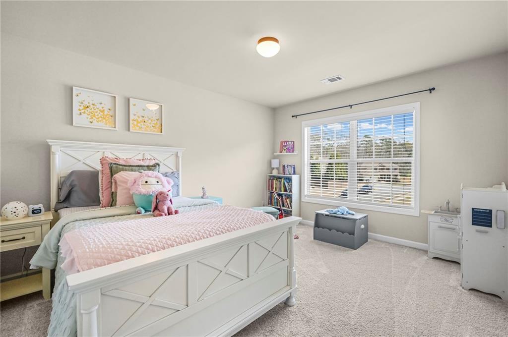 780 Springs Crest Drive Dallas, GA 30157 - Photo 26 of 47 a bedroom with a bed and a window