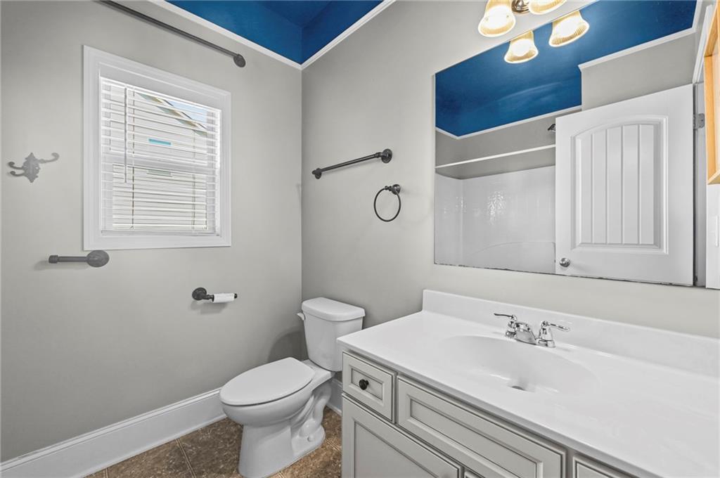 780 Springs Crest Drive Dallas, GA 30157 - Photo 28 of 47 a bathroom with a sink a toilet and a mirror