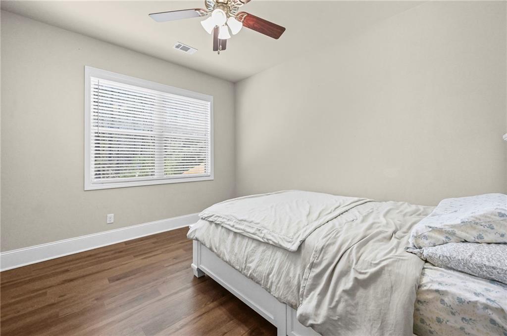 780 Springs Crest Drive Dallas, GA 30157 - Photo 31 of 47 a bed sitting in a bedroom next to a window