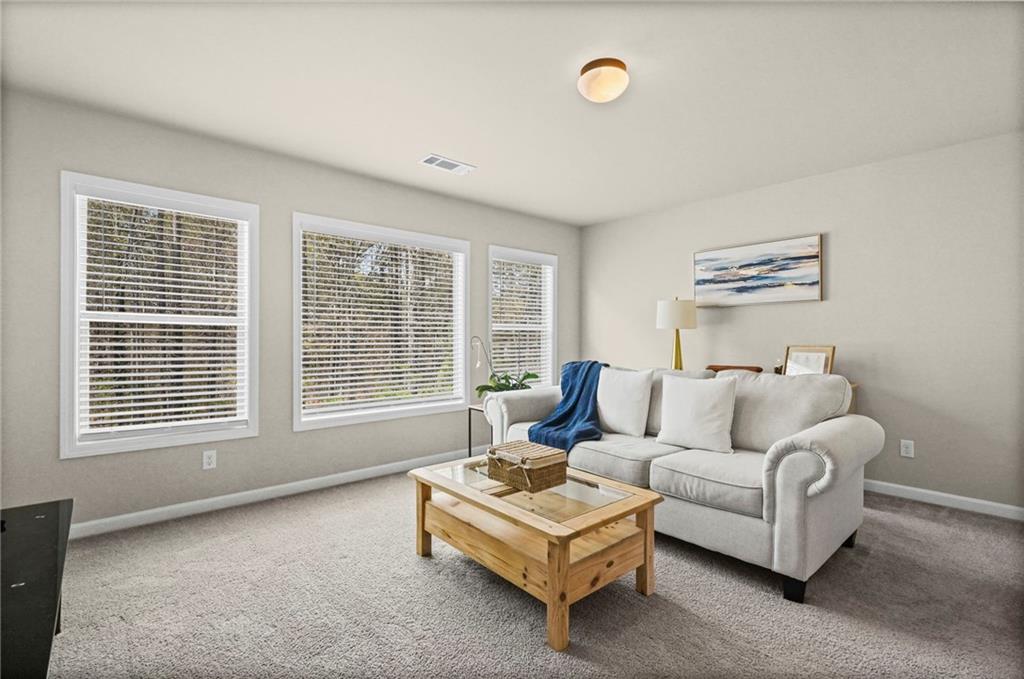 780 Springs Crest Drive Dallas, GA 30157 - Photo 33 of 47 a living room with furniture and a window