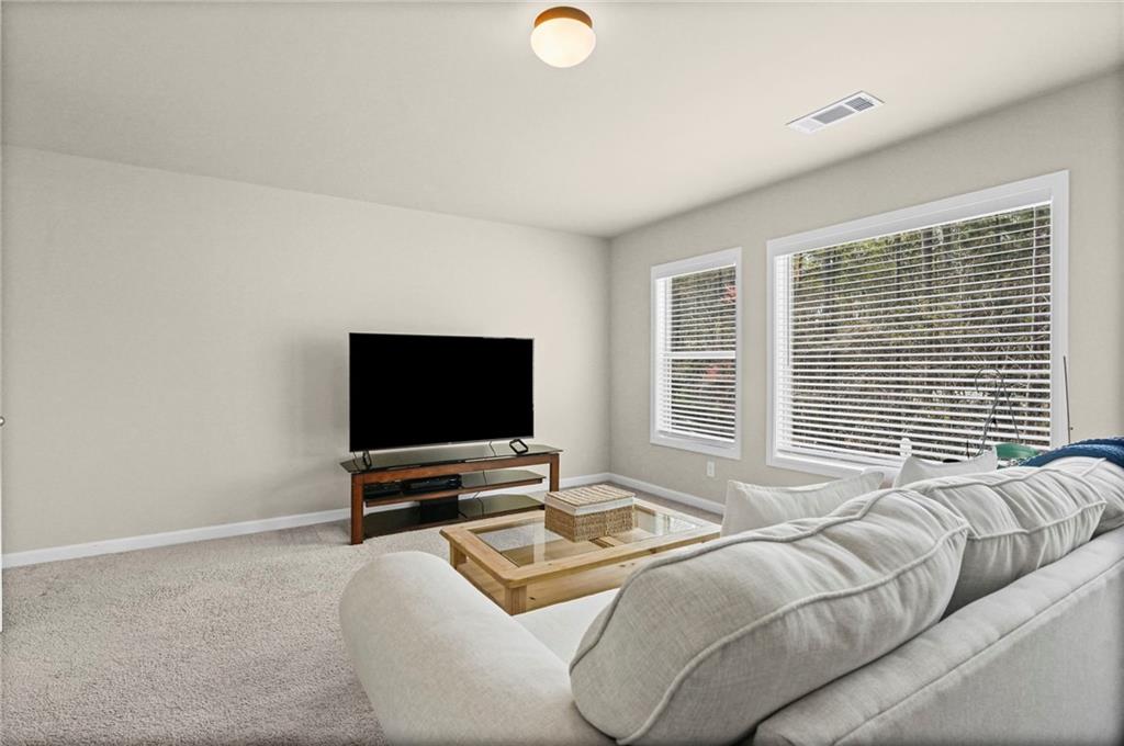 780 Springs Crest Drive Dallas, GA 30157 - Photo 34 of 47 a bedroom with furniture and a flat screen tv