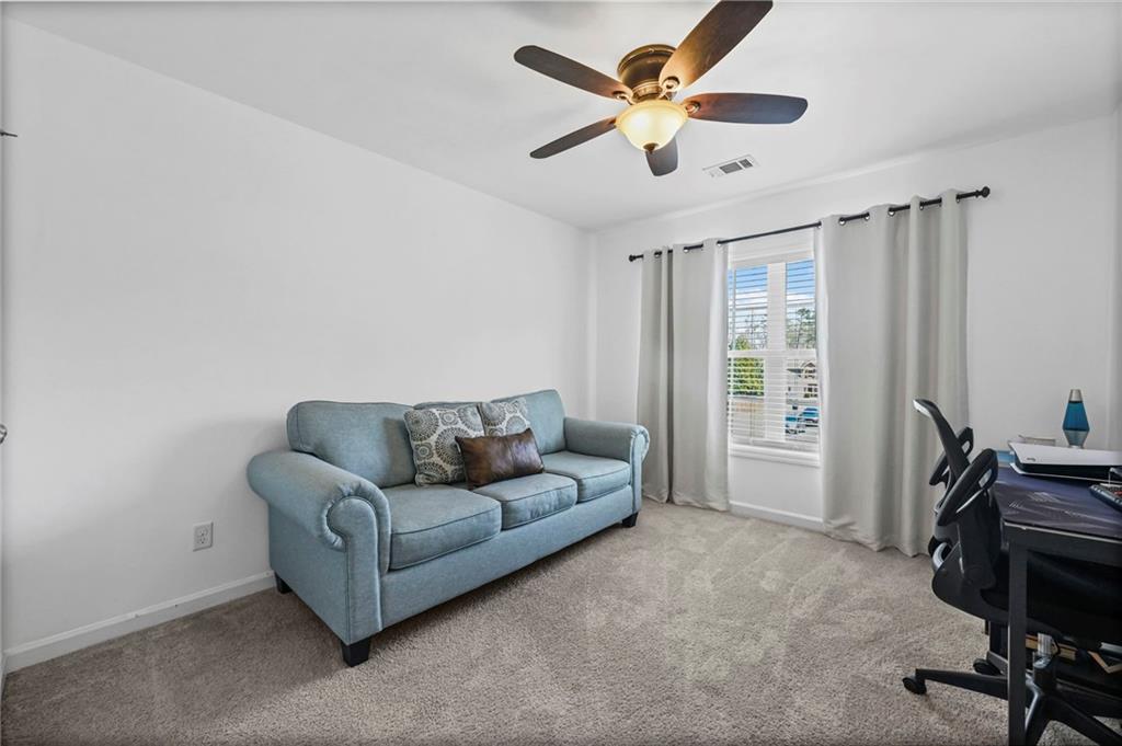 780 Springs Crest Drive Dallas, GA 30157 - Photo 38 of 47 a living room with furniture and a window
