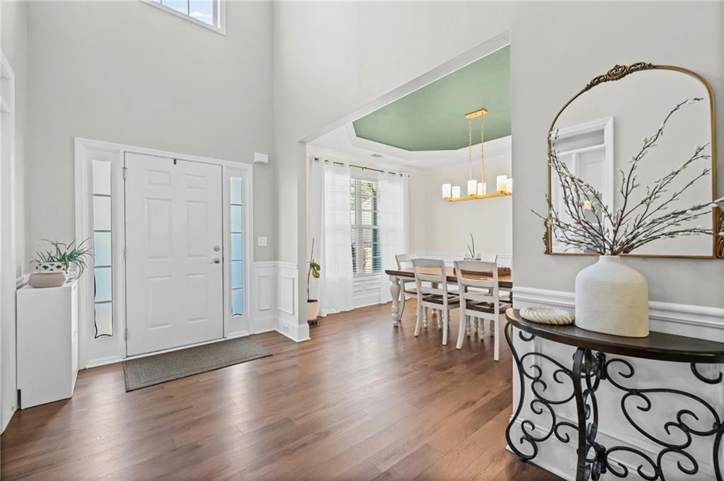 780 Springs Crest Drive Dallas, GA 30157 - Photo 4 of 47 a view of a dining room with furniture and wooden floor