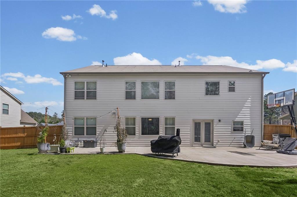 780 Springs Crest Drive Dallas, GA 30157 - Photo 41 of 47 a front view of a house with a garden and yard
