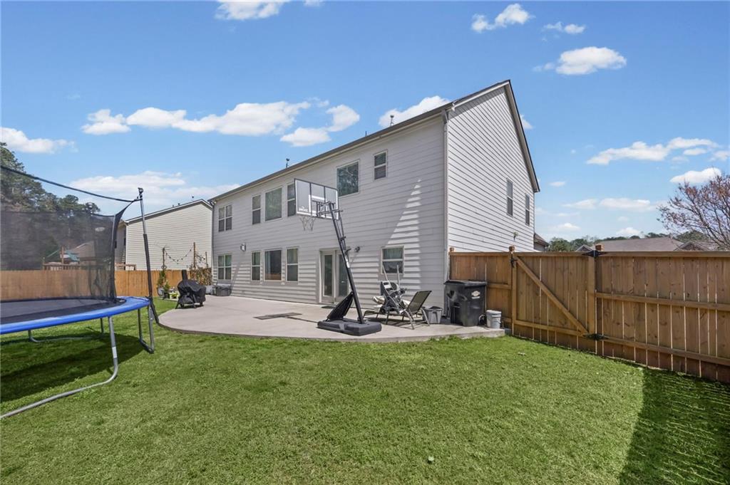 780 Springs Crest Drive Dallas, GA 30157 - Photo 43 of 47 a view of a house with a yard and sitting area