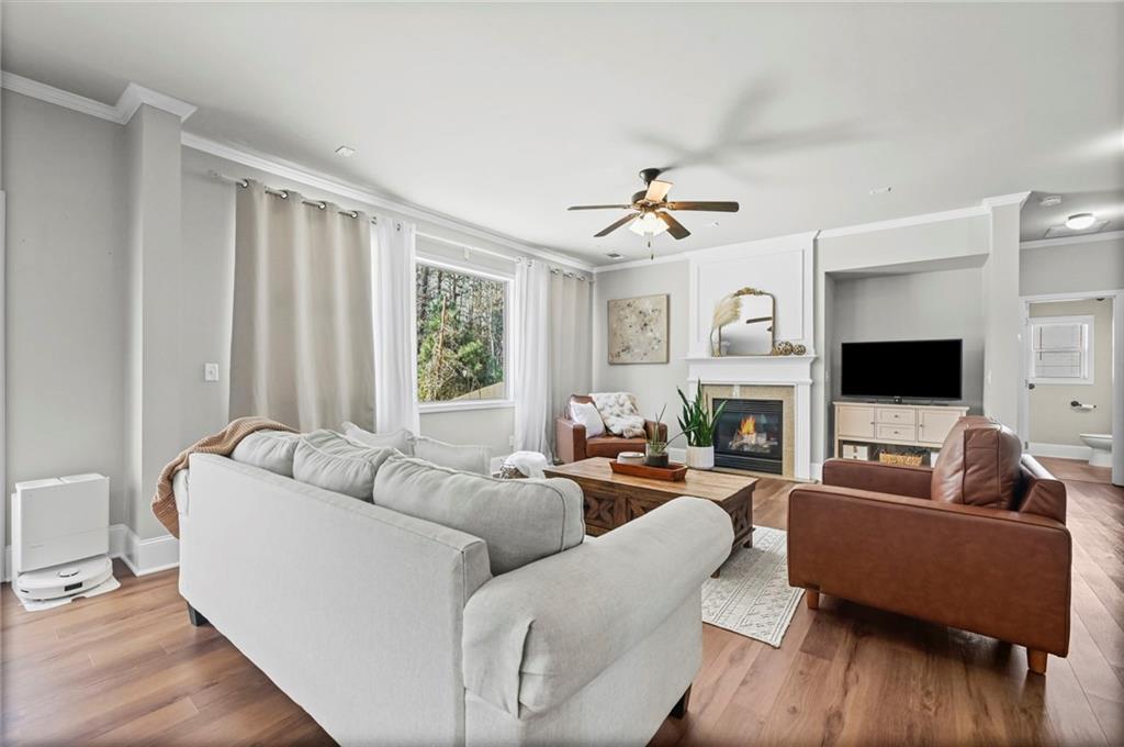 780 Springs Crest Drive Dallas, GA 30157 - Photo 9 of 47 a living room with furniture a flat screen tv and a large window