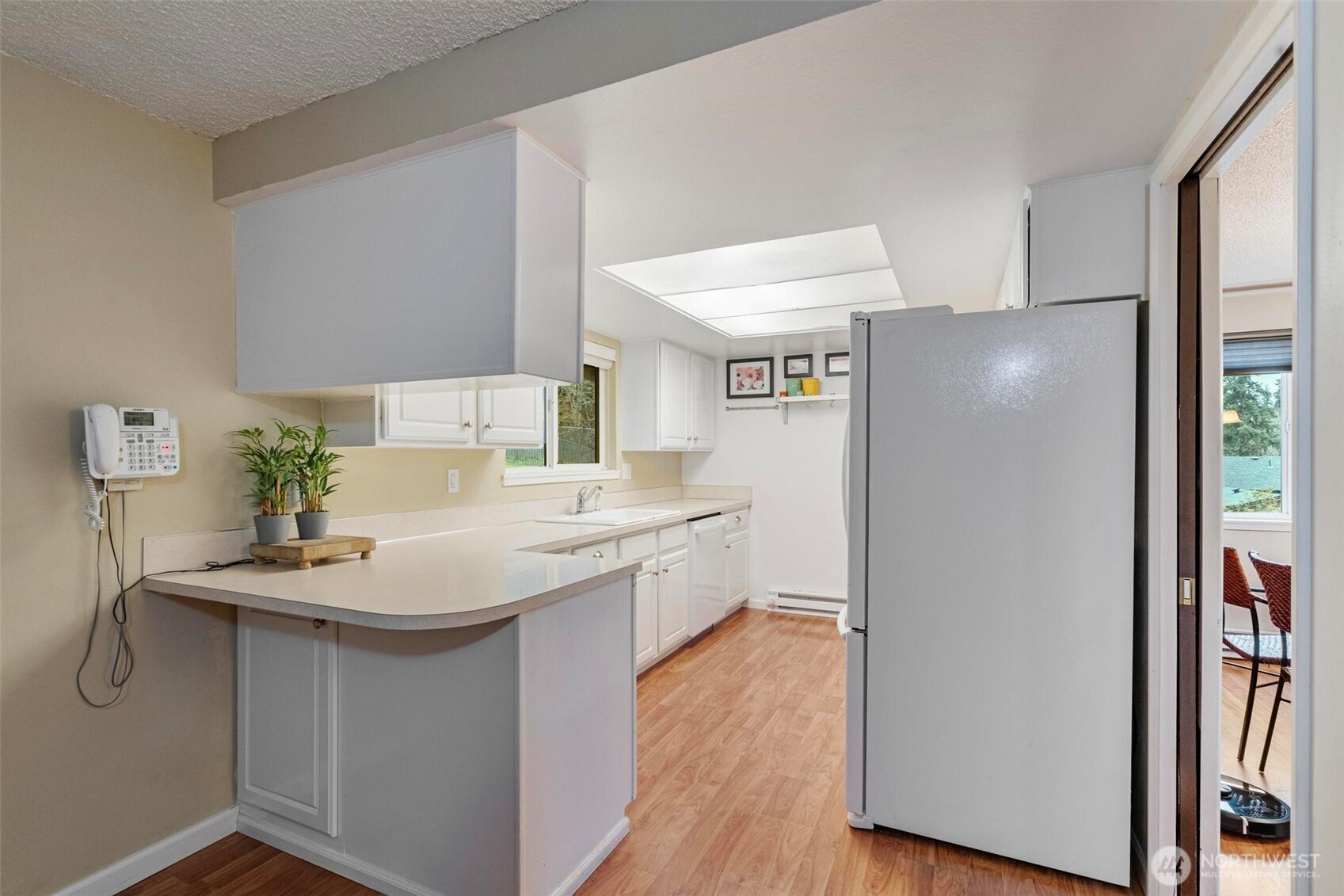 185 Brook Drive Chehalis, WA 98532 - Photo 14 of 40 a kitchen with a sink refrigerator and cabinets