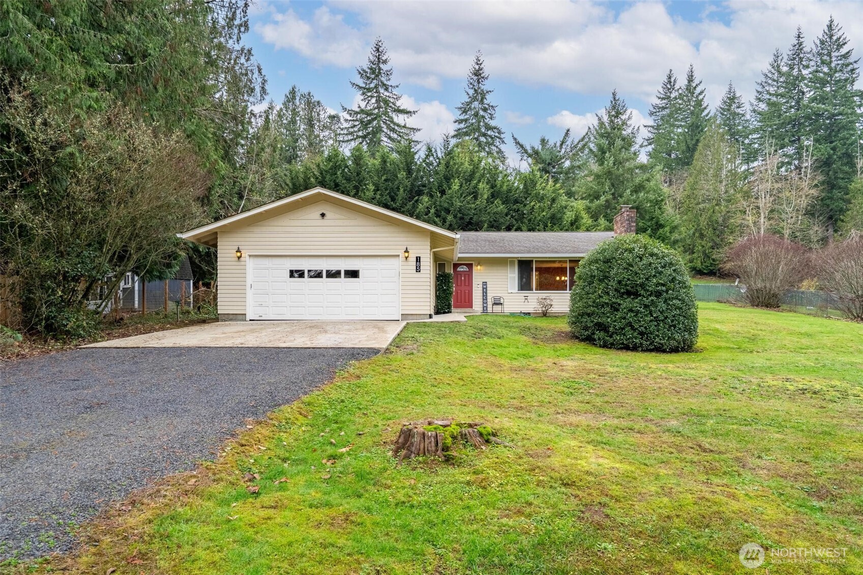 185 Brook Drive Chehalis, WA 98532 - Photo 2 of 40 a front view of a house with a yard and garage