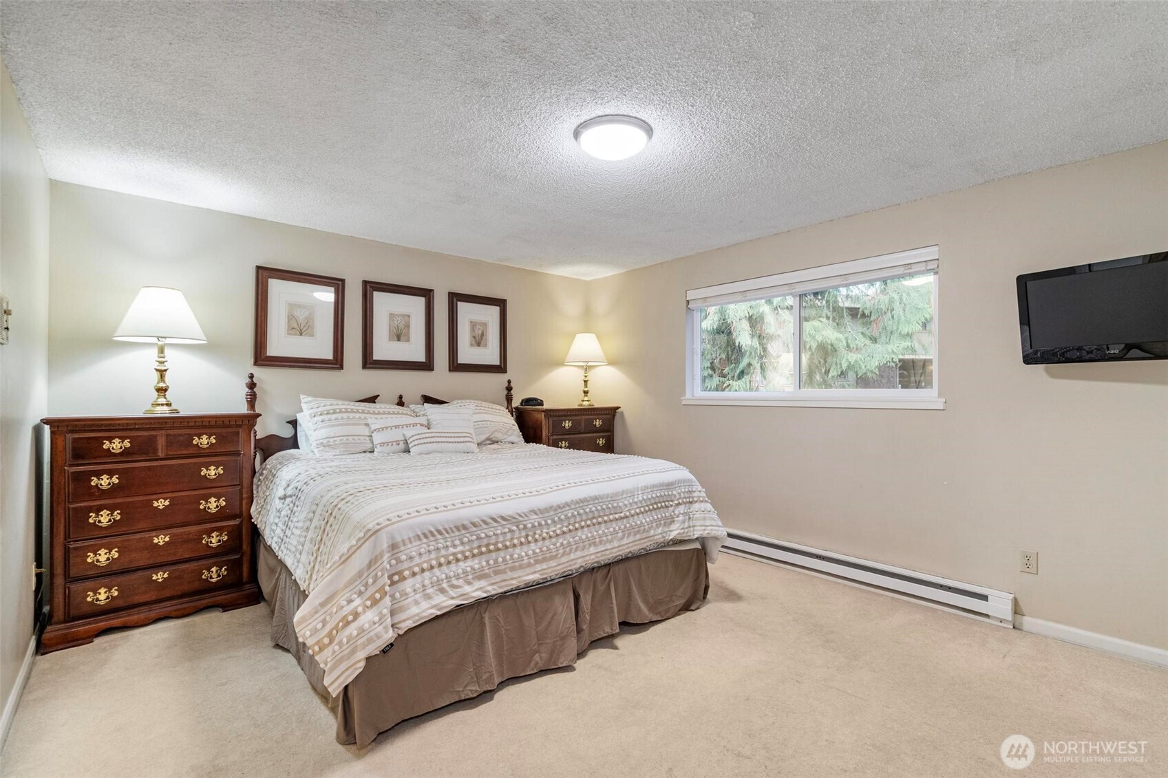 185 Brook Drive Chehalis, WA 98532 - Photo 21 of 40 a bedroom with a bed a mirror on dresser and a window