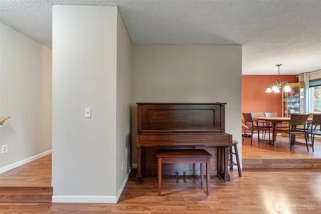 a view of dining room with furniture and wooden floor