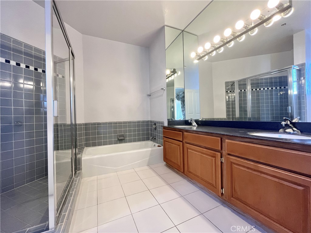 609 Fairview Avenue, Unit 2 Arcadia, CA 91007 - Photo 12 of 20 a bathroom with a bathtub a double vanity sink and mirror