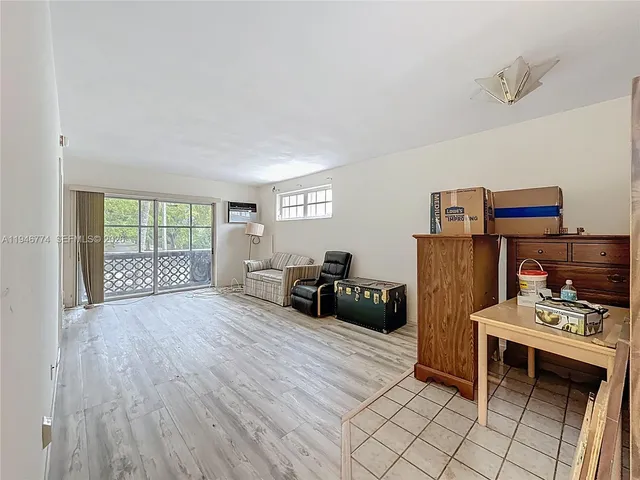 a view of a livingroom with furniture and wooden floor