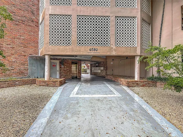 a front view of a house with basket ball court
